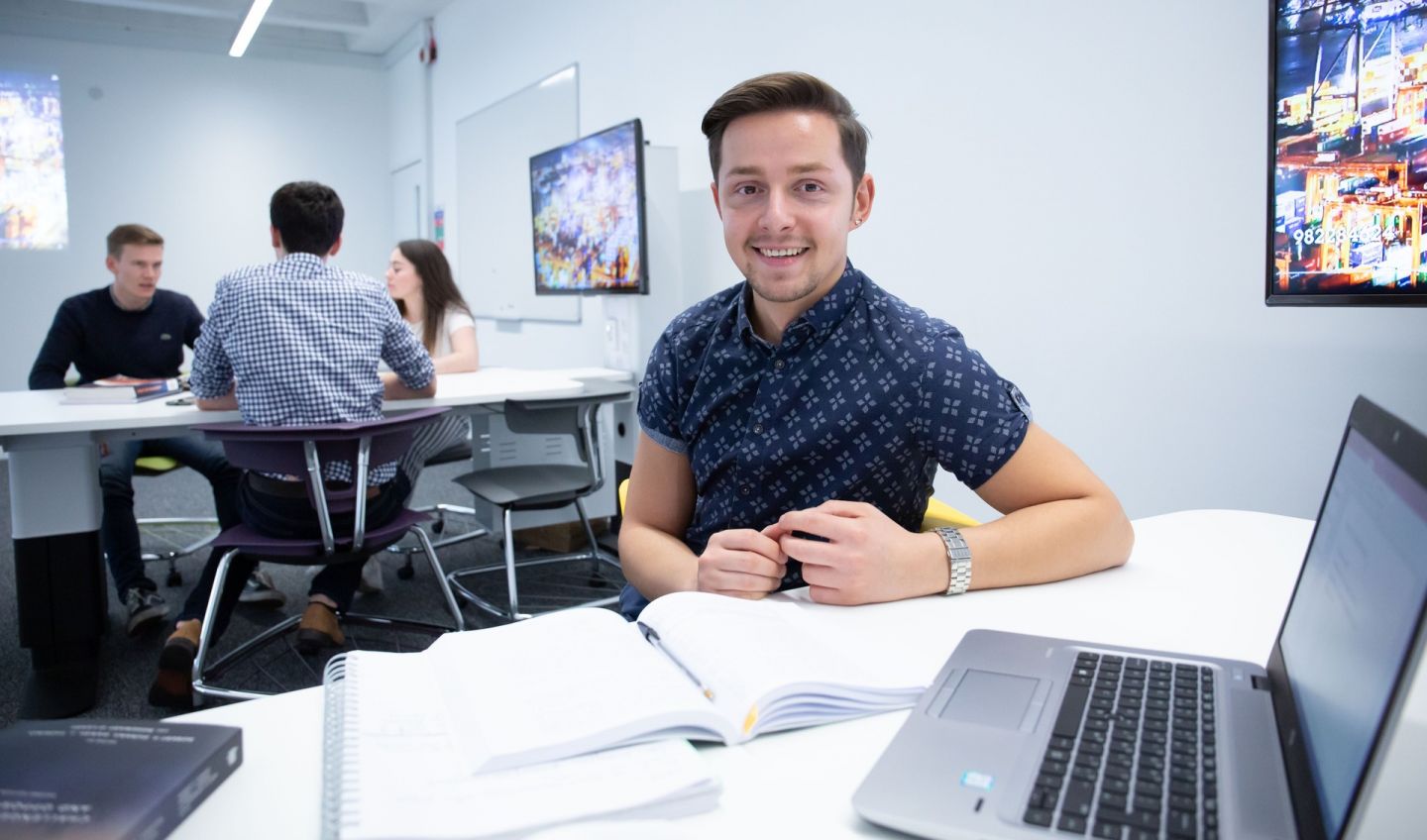 BA (Hons) International Business student in classroom at Glasgow Caledonian University