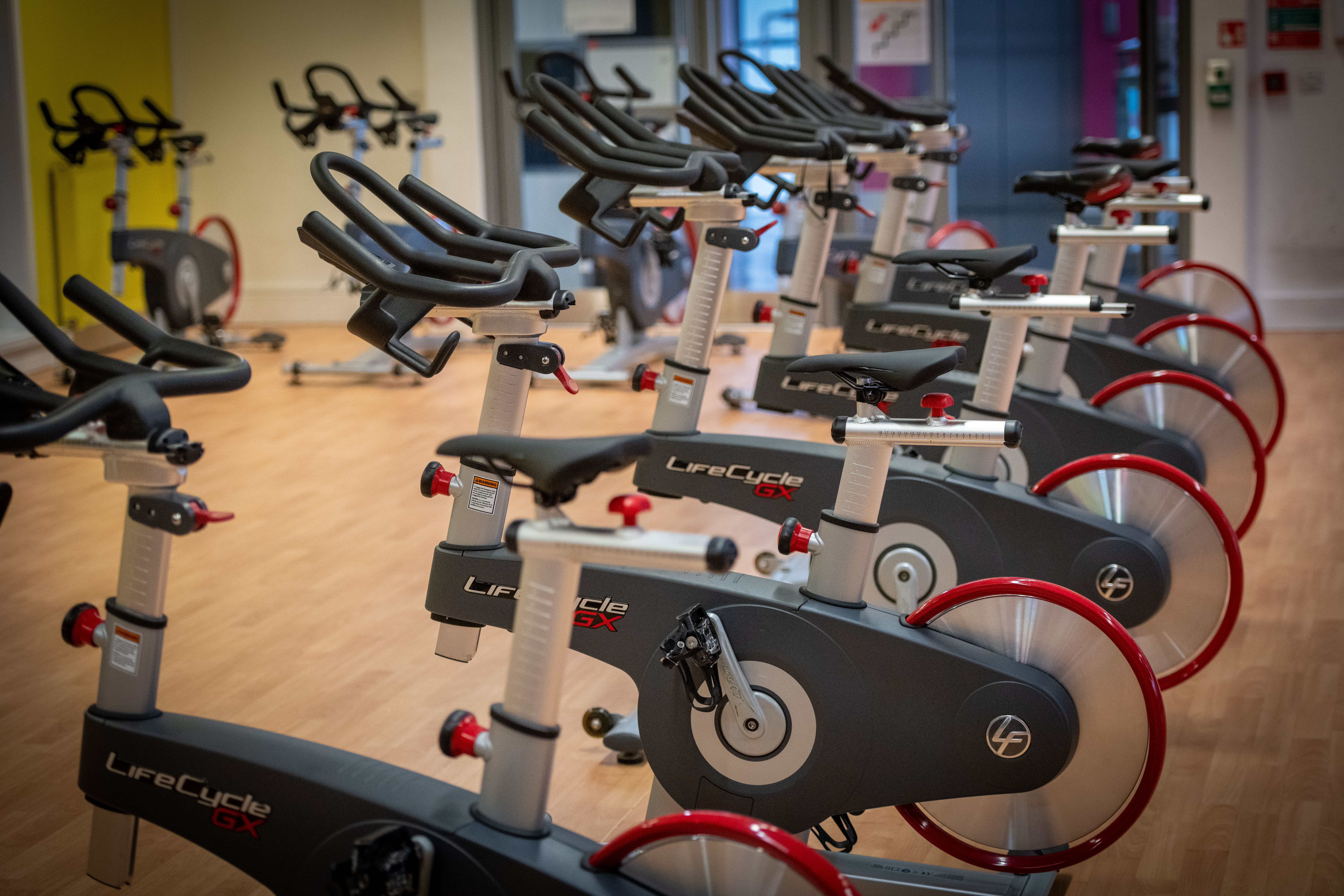 A row of exercise bikes in the ARC Gym, on GCU's Glasgow campus.