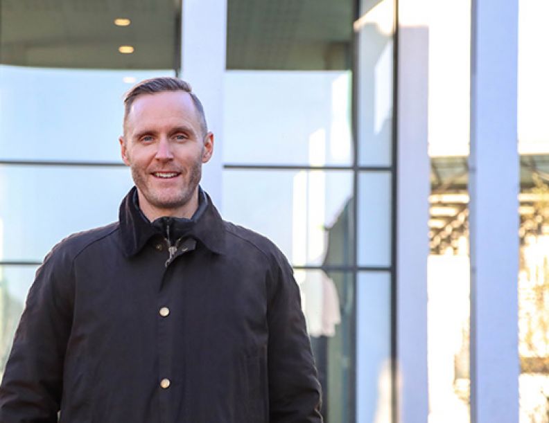 An image of Stephen Clark, GCU alumnus, graduate and Global Senior Director of Jordan at Nike on the GCU campus grounds.