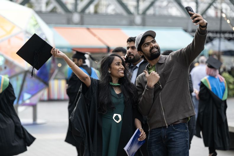 A student graduating from GCU London in 2024