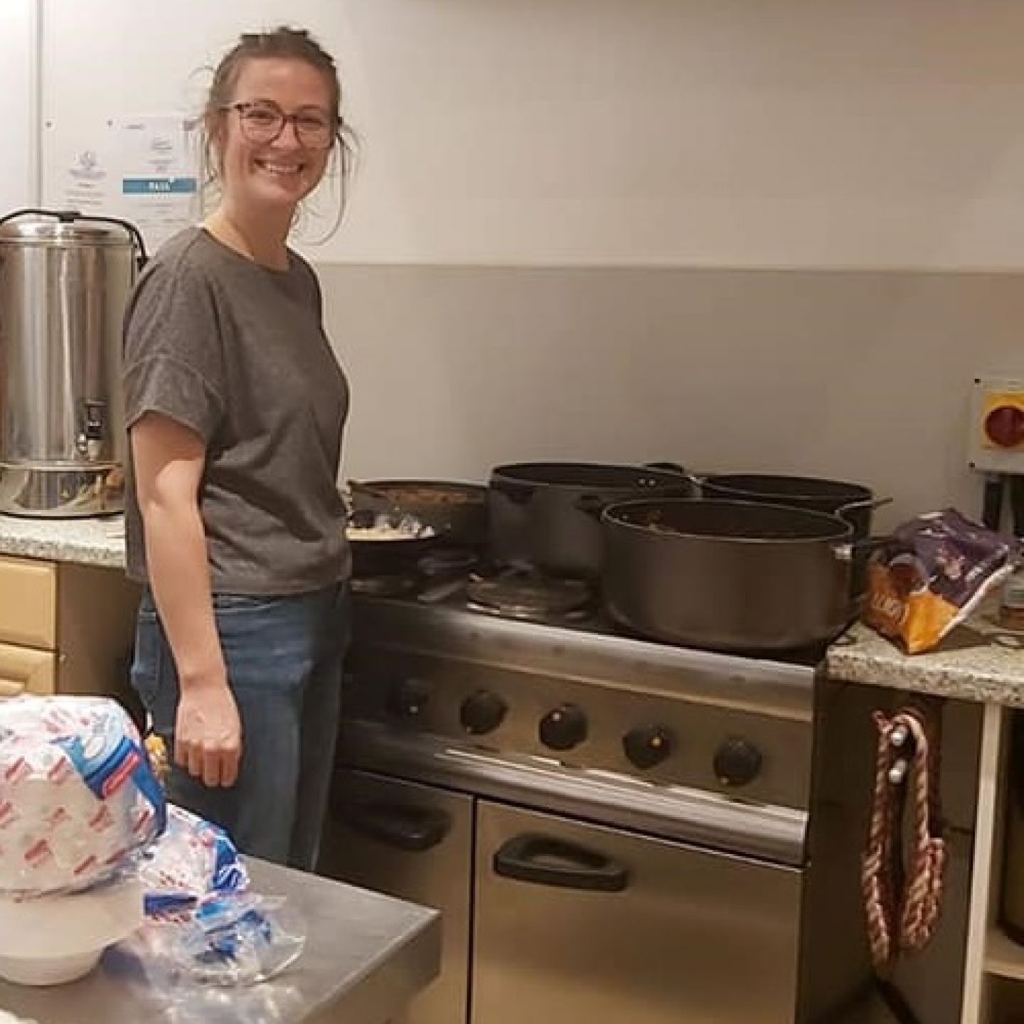 An image of GCU graduate Niamh Smith in a kitchen cooking.