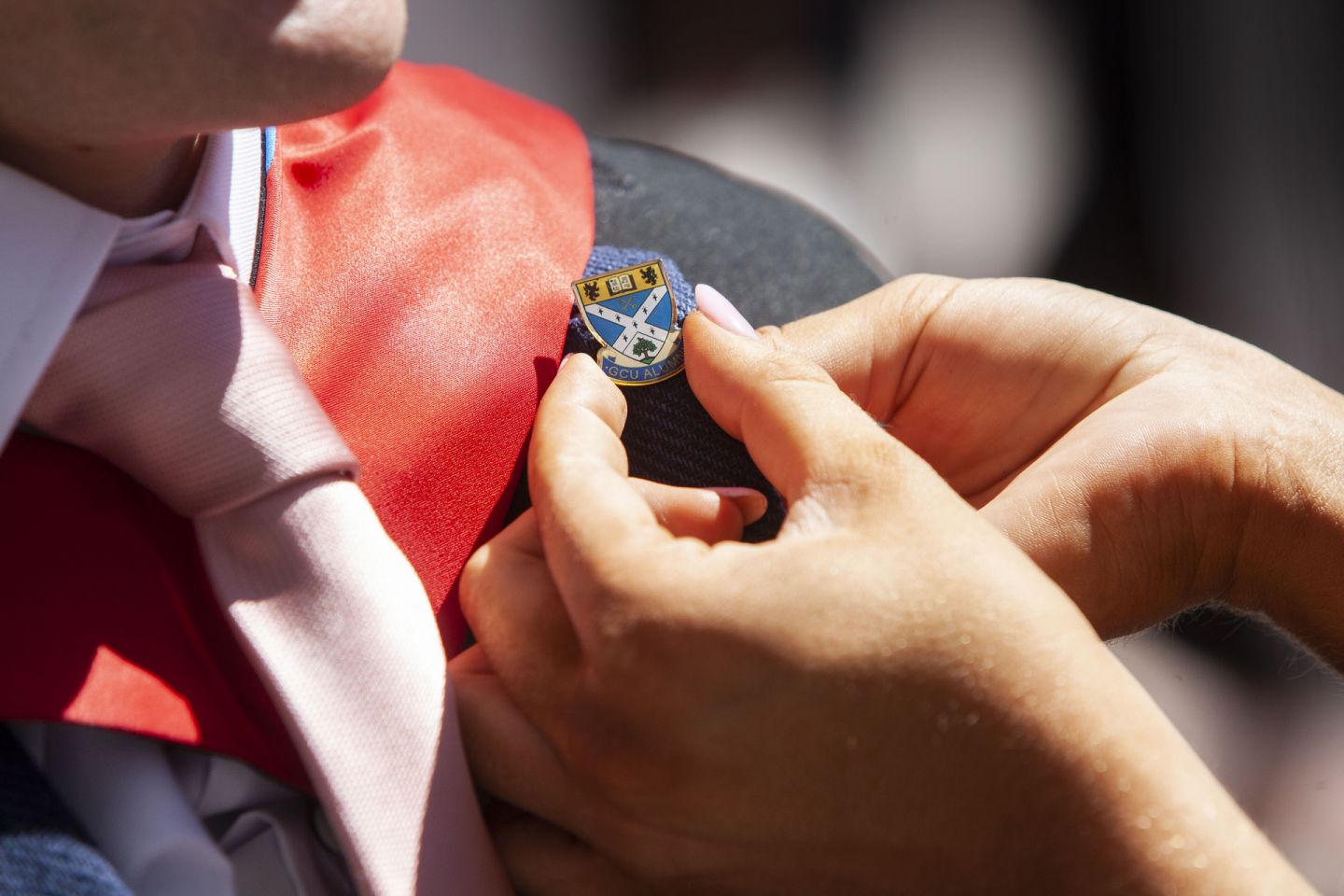 Glasgow Caledonian University alumni pin badge.