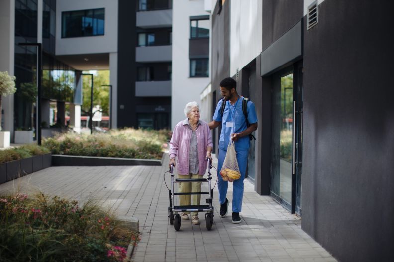 Women with walking support and nurse