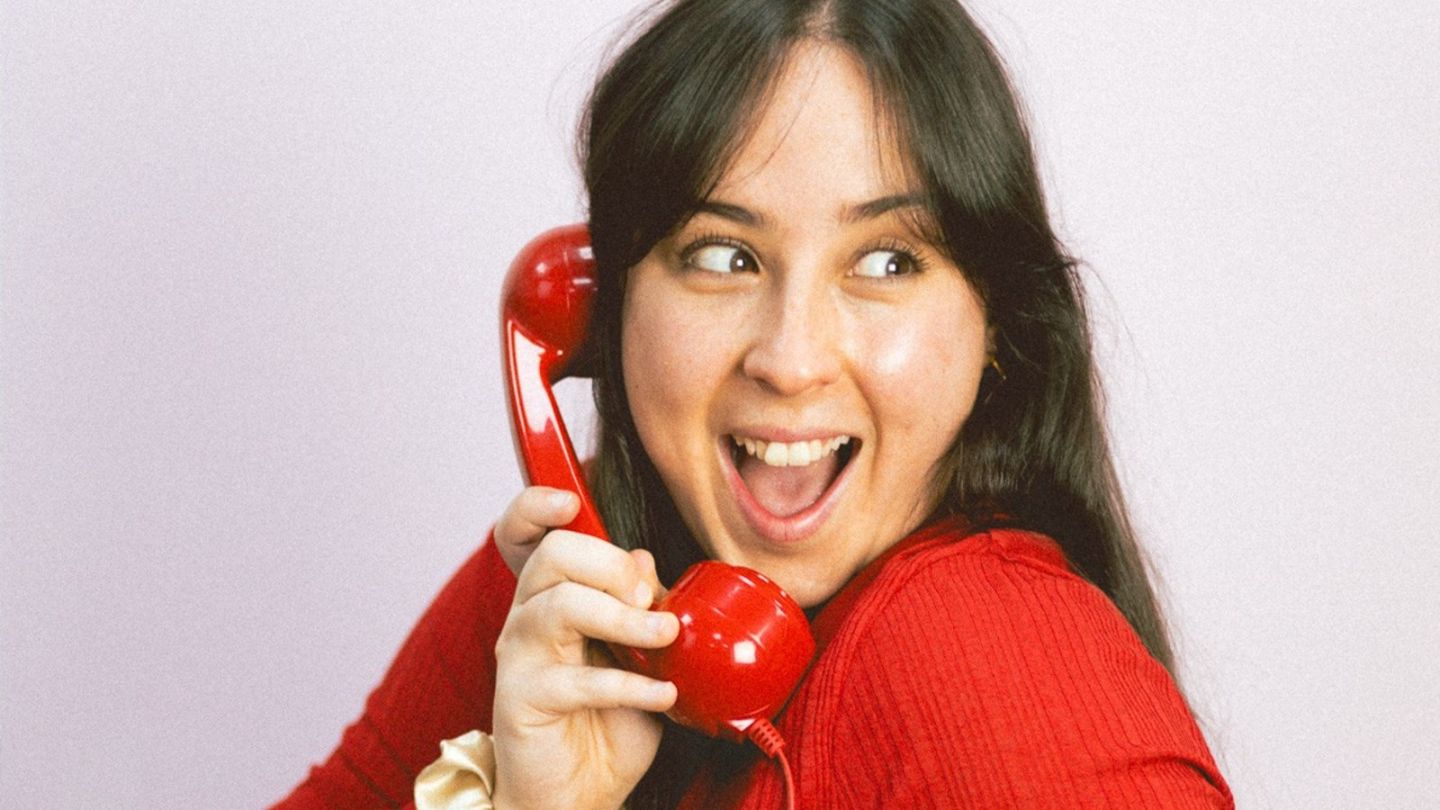 A photo of Chloe Doyle on the phone