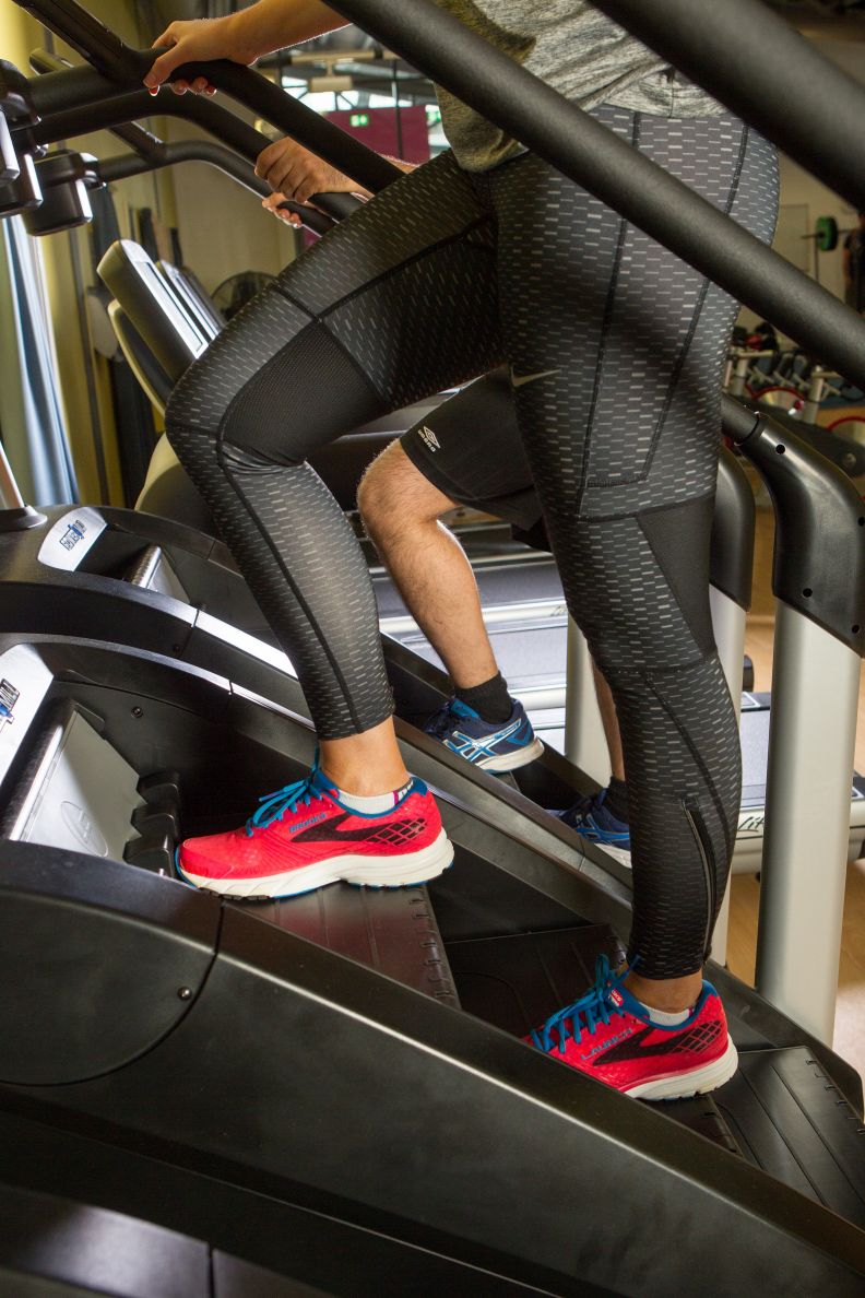 A close-up of trainers on cross trainer in ARC Health and Fitness, a multi-purpose gym located within Glasgow Caledonian University campus.