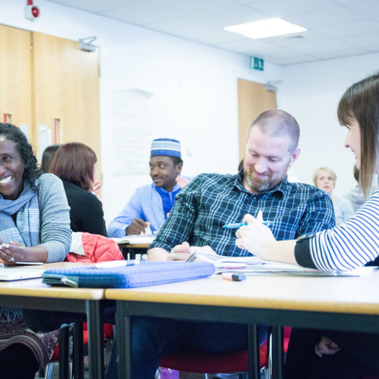 Professional Doctorate Programme students in classroom at Glasgow Caledonian University