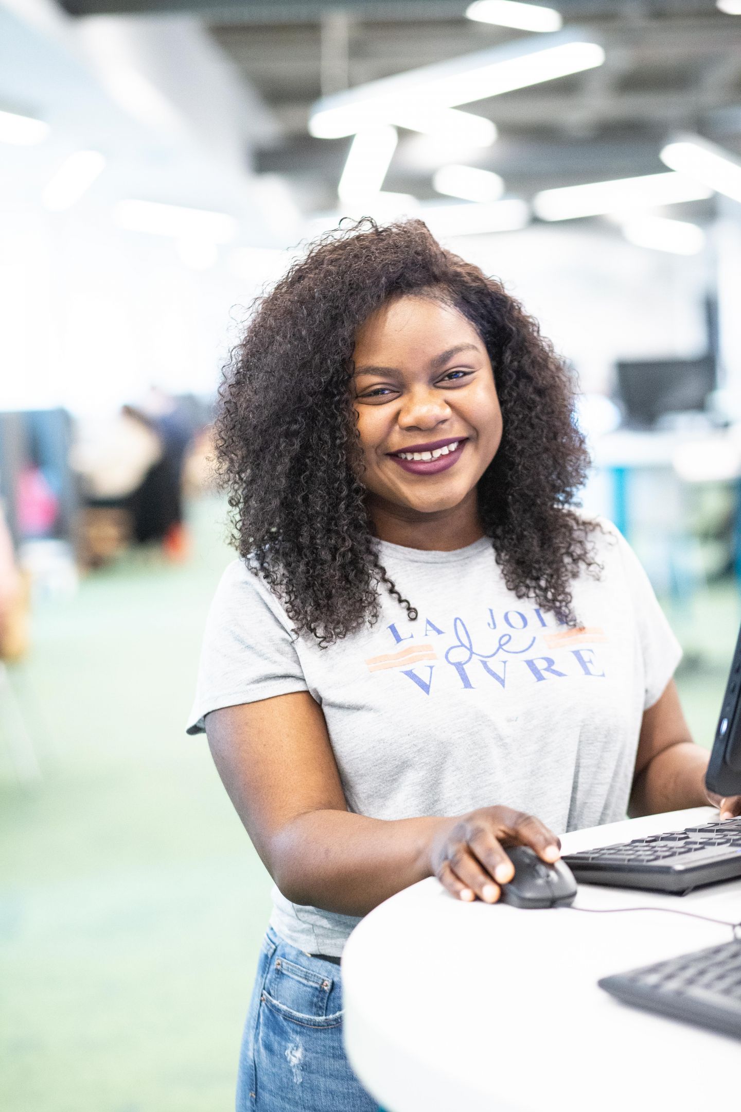 Undergraduate Student using a computer on campus