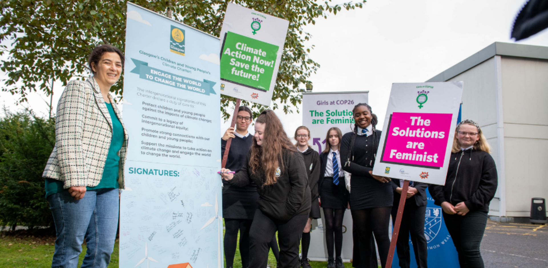 GCU's Dr Tuleen Boutaleb joins Glasgow schoolgirls as they sign the climate charter at Girls@COP26 event
