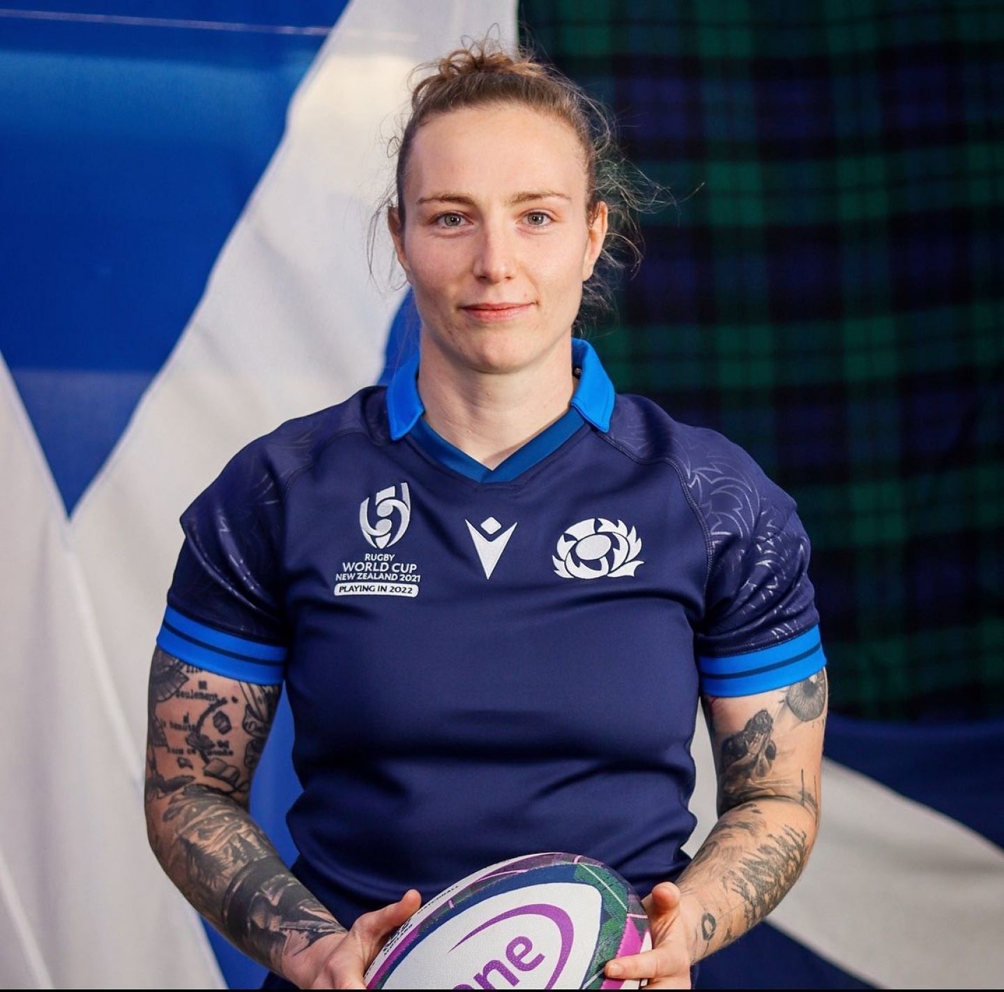 GCU Alumna and Scotland Rugby player Jade Konkel in Scotlans rugby strip holding a rugby ball.
