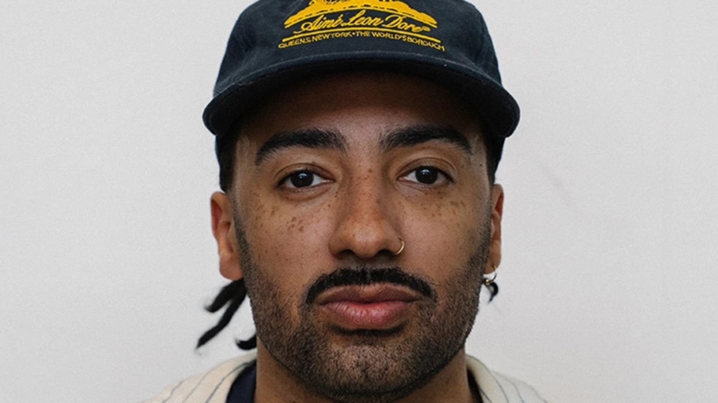 A photo of Barrington Reeves wearing a snapback hat