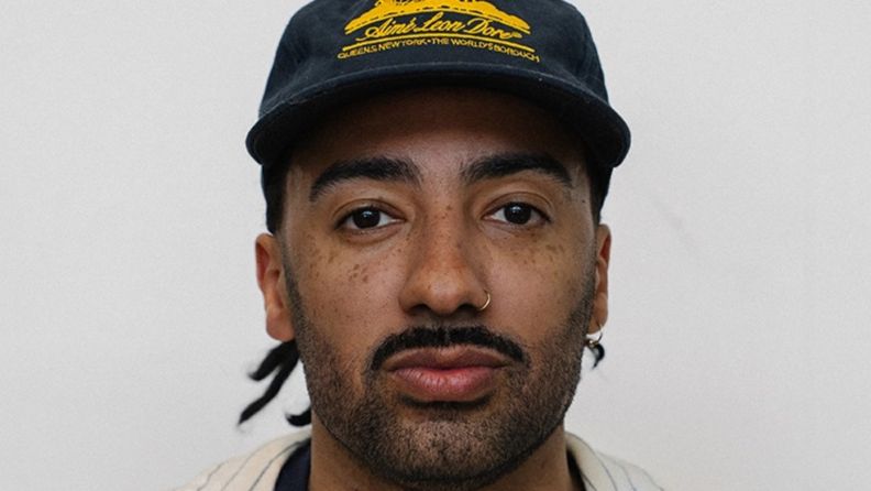 A photo of Barrington Reeves wearing a snapback hat