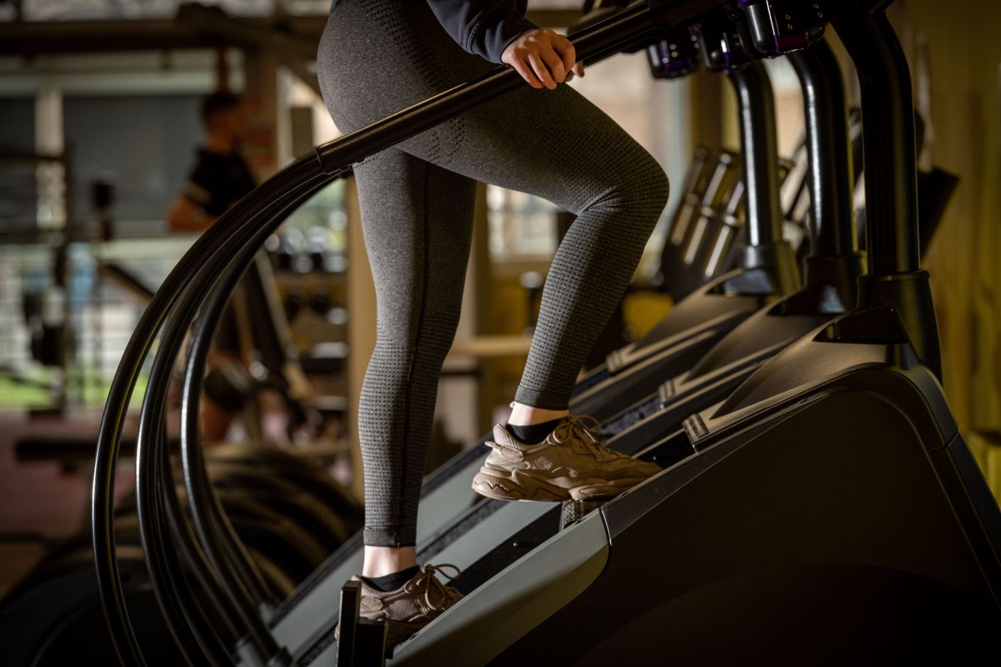 A person using a StairMaster exercise machine, in the ARC Gym on GCU's Glasgow campus.