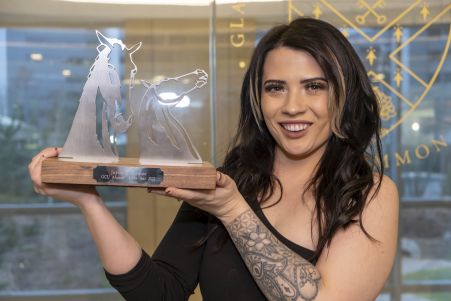GCU Alumna and Alumni of the Year (AOTY) winner Jayde O'Connor holding her AOTY award