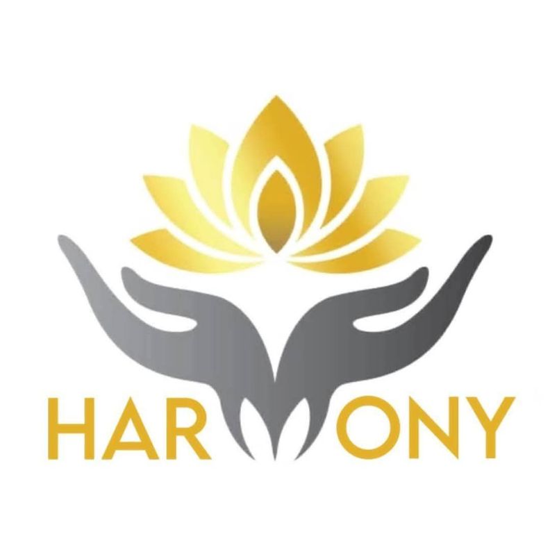 The Harmony Global For Humanitarian Action logo, which features a graphic of a silver pair of hands holding a gold lotus flower on a white background, above the organisation name.