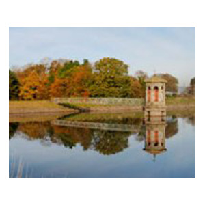 Dam and reservoir with reflection in the water