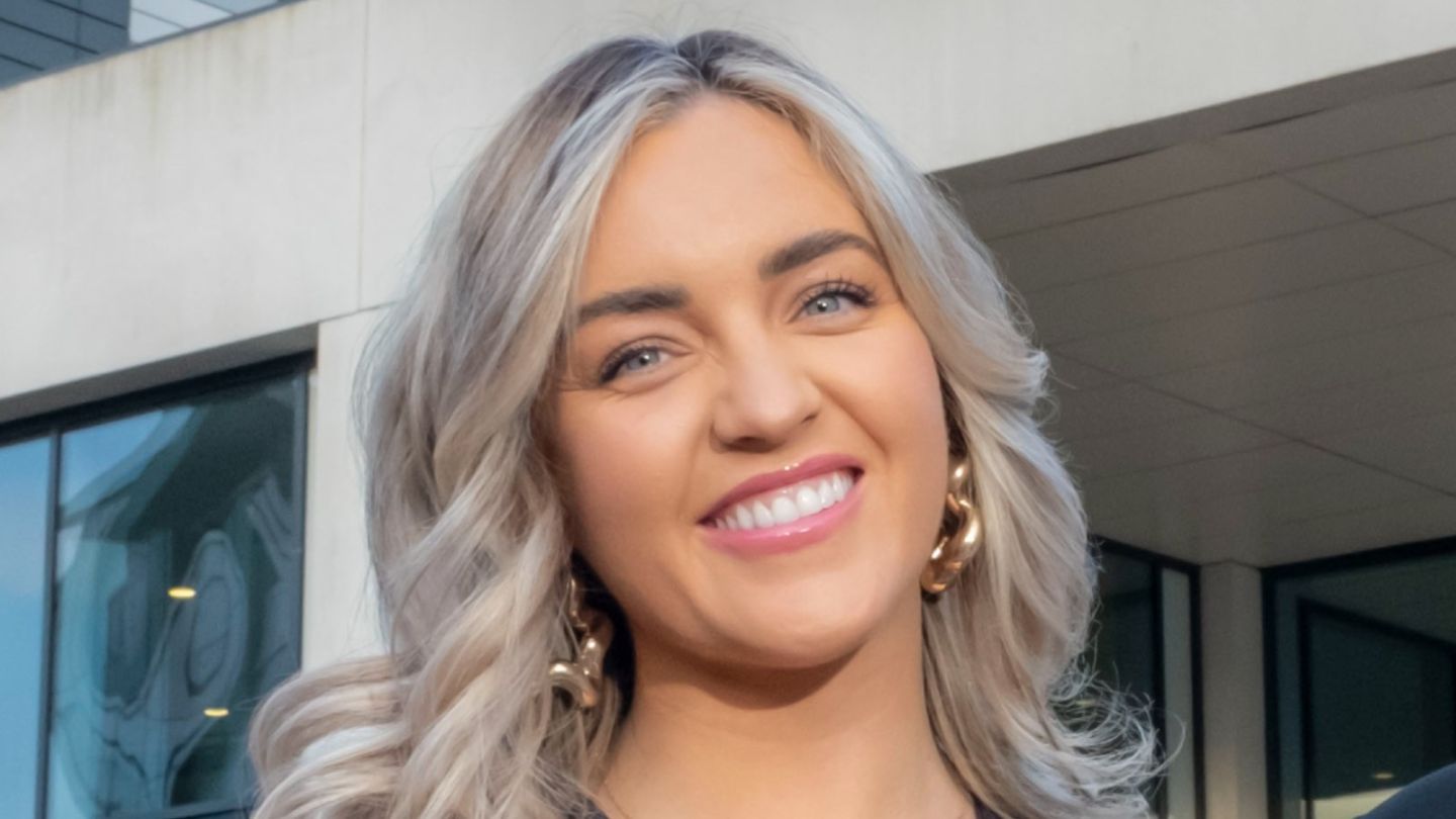 A photo of Amy Moore smiling outside of GCU campus