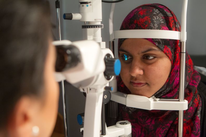 Glasgow Caledonian University optometry student performing eye examination