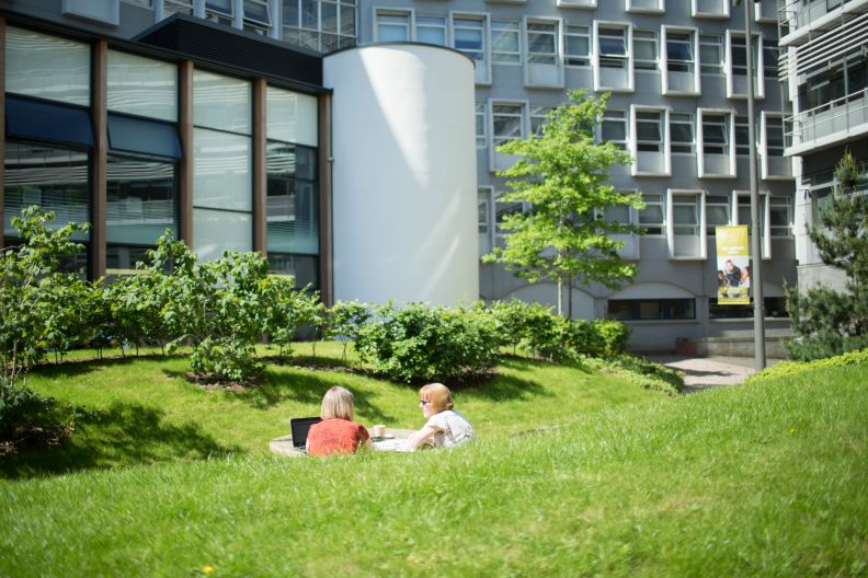 Studebnts in the courtyard gardens at GCU's Glasgow campus