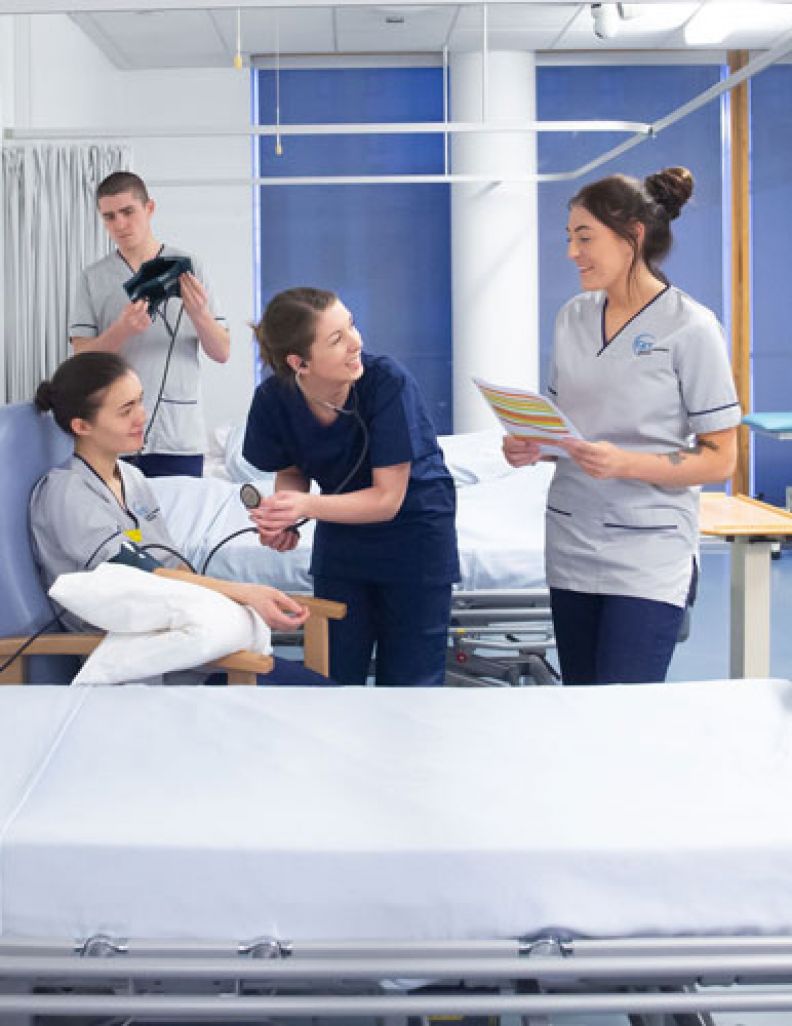 Nursing students working in the nursing ward on campus