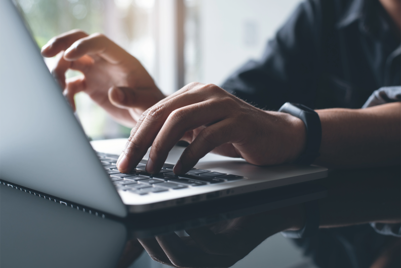 Staff using AI on laptop