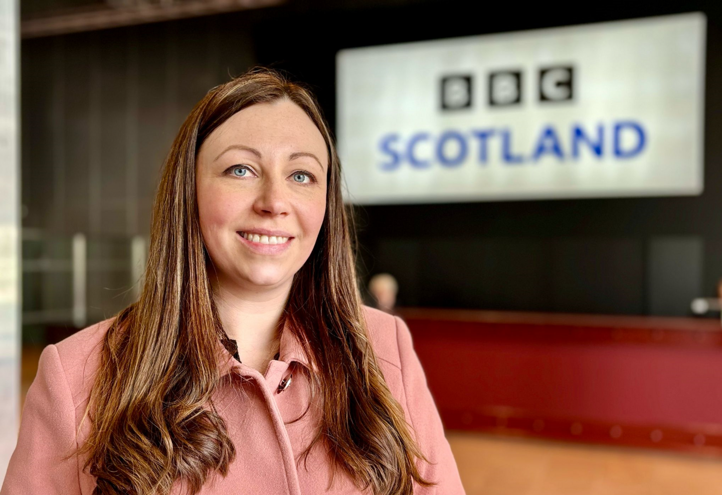Emma Clifford Bell with BBC Scotland sign