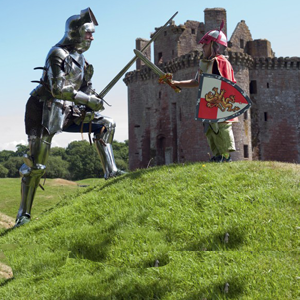 Child with a toy sword playing with a knight in armour