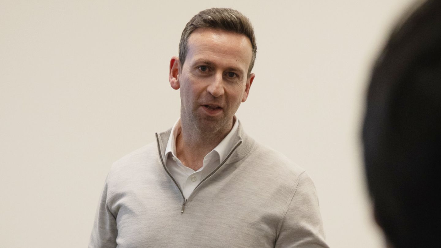 A photo of James Fennessey speaking to students