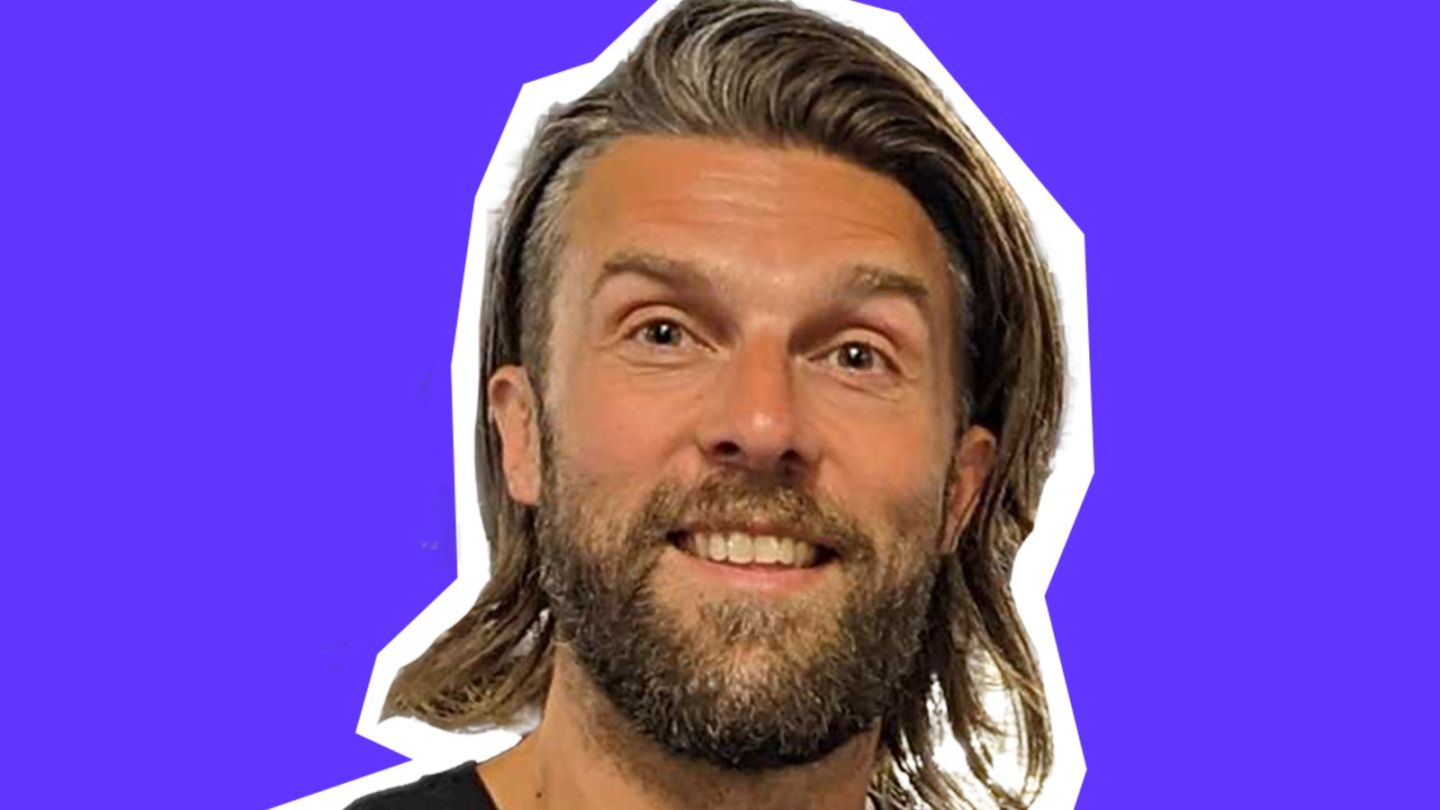 A cutout photo of David Haddow against a blue background